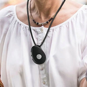 Senior-wearing-a-mobile-medical-alert-pendant-with-fall-detection-in-Canada.webp