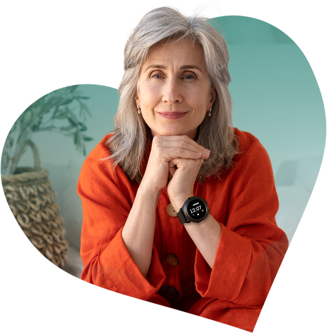 Smiling senior woman wearing a medical alarm smartwatch, inside heart graphic representing care and protection